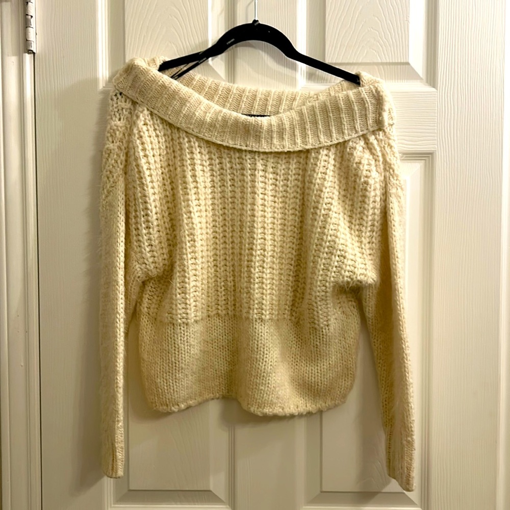 Soft "wool like" material, cream sweater